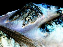 NASA have inferred that these narrow dark streaks formed by contemporary flowing water on Mars's surface. Credit: NASA/JPL/University of Arizona.