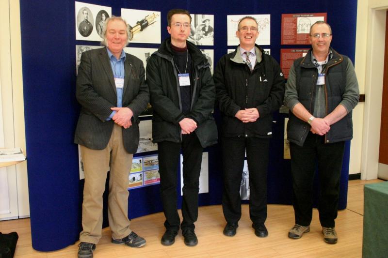 Bob Marriott, Lee Macdonald, Mike Frost and Paul Haley, in front of the Gill-100 Display (image Lorraine Crook)
