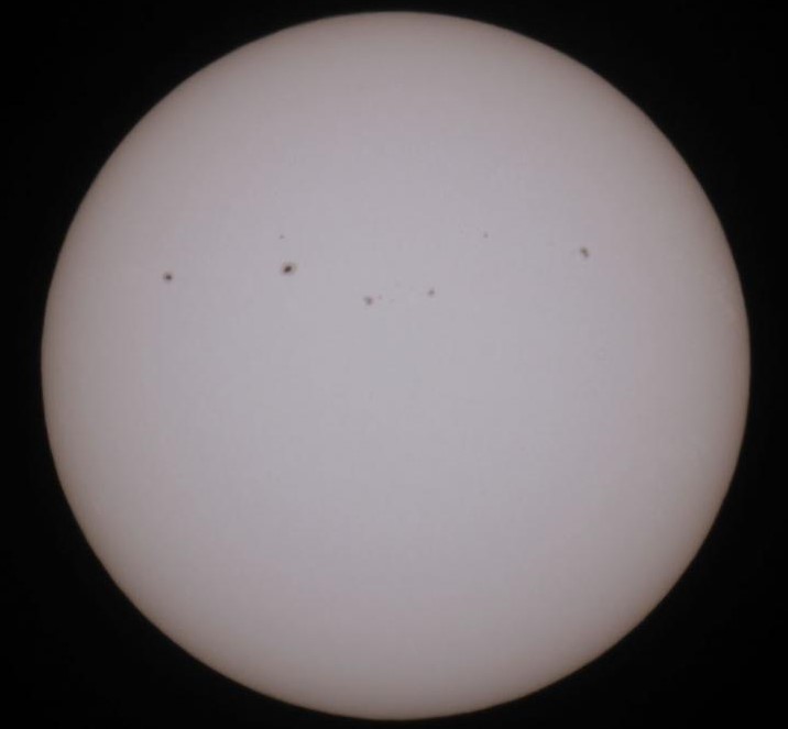 The Sun imaged through a specialist, safe, solar filter showing a row of sunspots (image courtesy James Dawson).