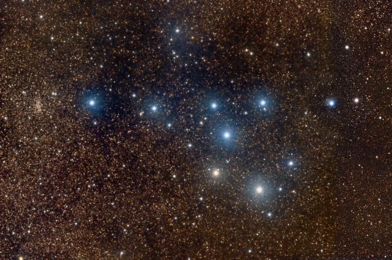 Brocchi’s Cluster (the Coathanger). The field of view is 129×85arcmin. This is a mosaic of two images and covers an extremely rich area of the Milky Way, filled with faint golden stars. Inspection of the image reveals the open cluster NGC 6802 at the left side and the small, faint emission nebula, Sharpless 2-83, visible as a pink patch at the top of the image to the right of centre. We can also see something of a faint reflection nebula, Lynds’ Bright Nebula 130, towards the centre and top of the image. The data were captured from Cambridge on 2017 Sep 11, 12 & 15, comprising 50 minutes each of RGB data in 2min subs, and a further 20 minutes each of RGB in 1min subs to secure the colours of the brightest stars. Image by David Davies