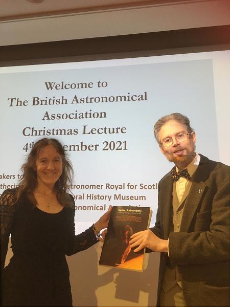 The President hands Alexandra Hart her 2020 Steavenson Award, at the 2021 Christmas Meeting. Photographs of the presentations to the 2021 winners will appear in the full report of this meeting. (Photograph by Marie-Louise Archer)