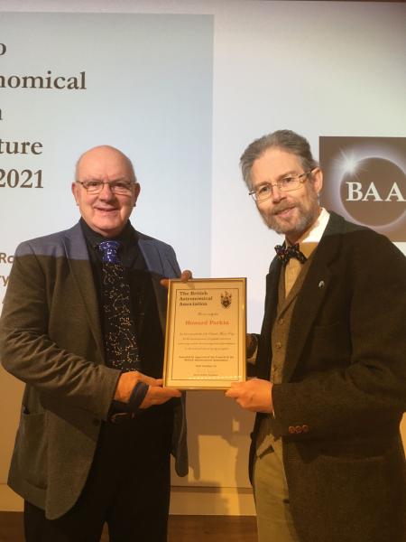 Howard Parkin is presented with the Sir Patrick Moore Prize, of which he is a joint winner for 2021. (Photograph by Marie-Louise Archer)