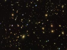 Figure 1. Abell 2163, a distant cluster of galaxies, all receding from us. (Source Wikimedia Commons, originator NASA/ESA/Hubble)