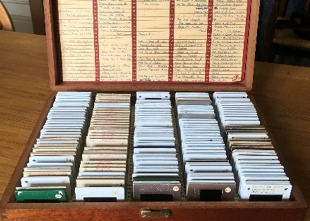 The wooden box of numerous colour slides, open on a table