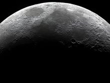 The waxing crescent Moon, oriented with Mare Crisium roughly central.