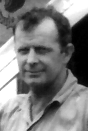 A black and white image of Merv, smiling, in middle age