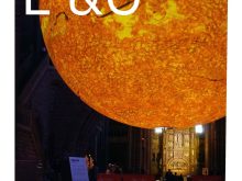 A large sun art installation in a cathedral